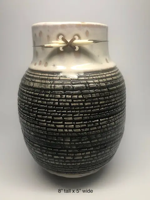 A vase with sticks