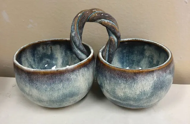 A Conjoined set of teal bowls image
