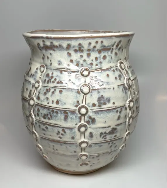 A brown and white vase
